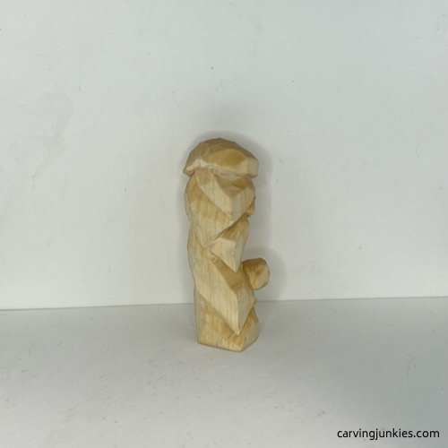 Right side of wood carved Christmas tree ornament before painting RIght view of unpainted wood carved Christmas tree ornament