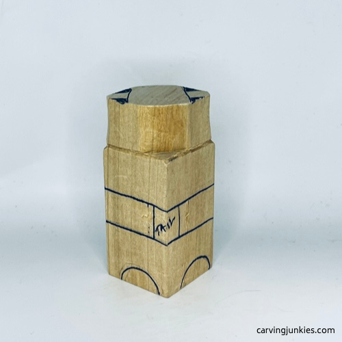 Back paws on wooden carved dog