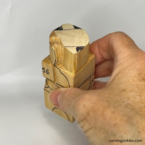 Right progress photo of wooden carved dog