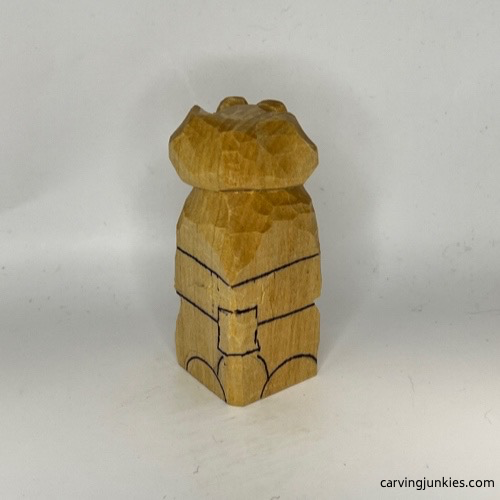 Back guidelines on wooden dog carving