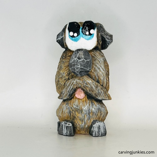 Front of painted wood carved dog