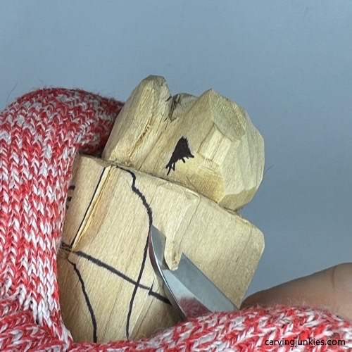 Carving mid sections of wooden dog