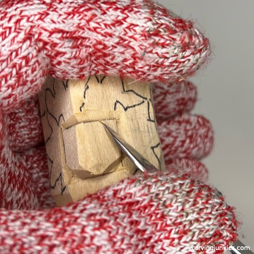 Rounding nose on wood carved autumn gnome Separating nose on wood carved fall gnome