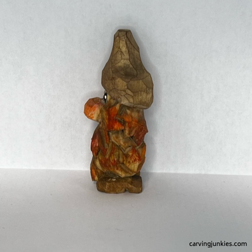 Left view of painted wood carved autumn gnome Painted right of fall gnome wood carving
