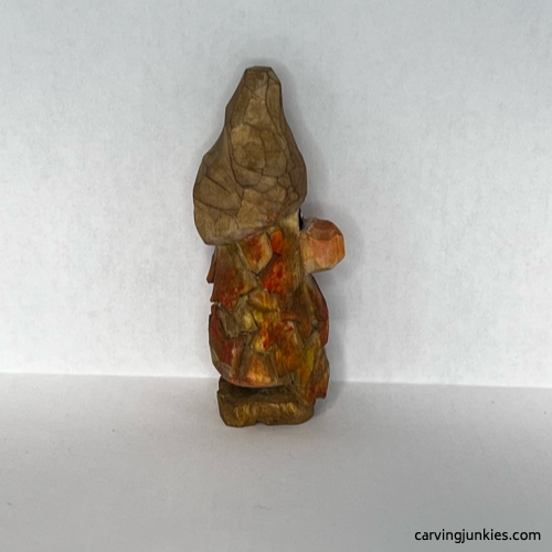 Right view of painted wood carved autumn gnome Painted right of fall gnome wood carving