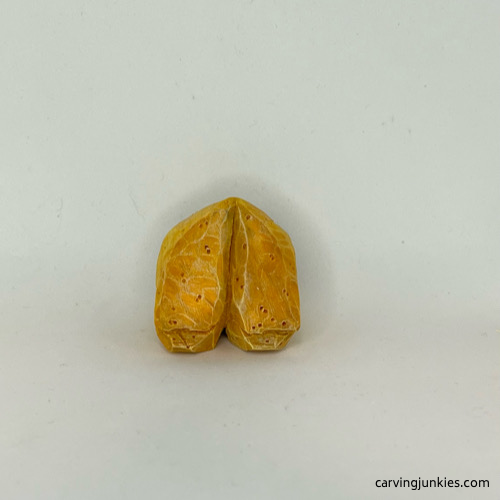 Front of painted wood carved fortune cookie