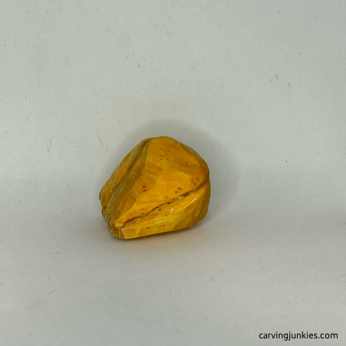 Left side of painted wood carved fortune cookie