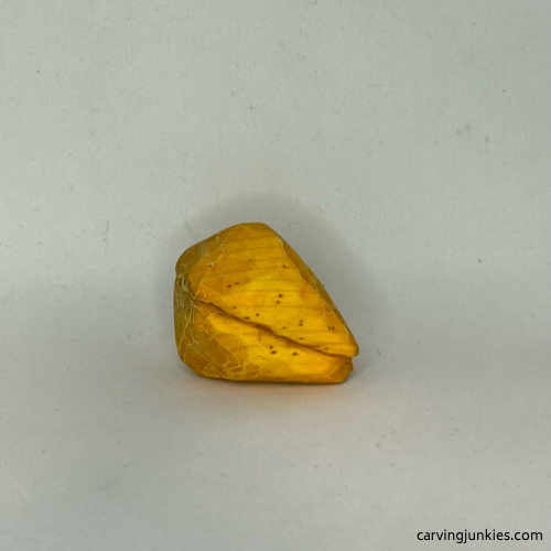 Right side of painted wood carved fortune cookie