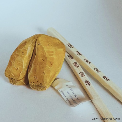 Painted wood carved fortune cookie