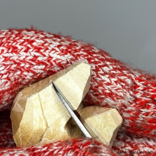 Carving ears on wood carved fox