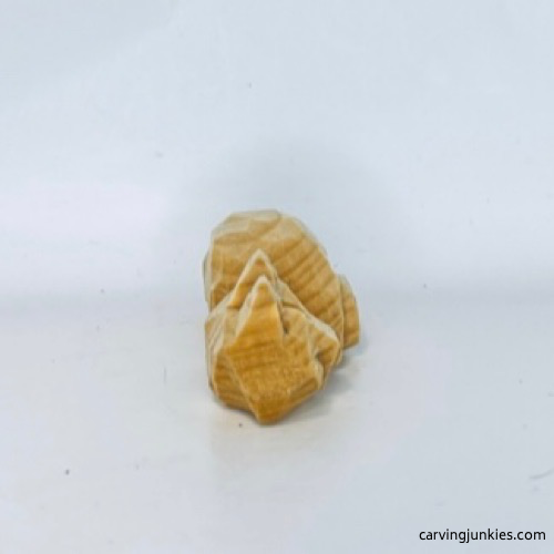 Right view of unpainted wood carved fox