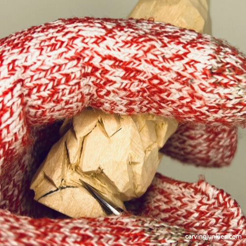 Refining shoes on wood carved autumn gnome Carving tops of feet on fall gnome wood carving