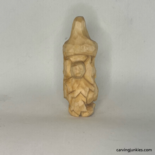 Front of unpainted wood carved autumn gnome Unpainted front of fall gnome wood carving