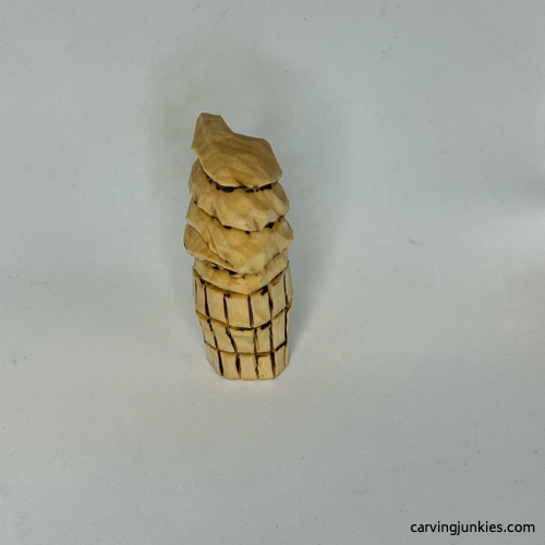 Back view of wood carved ice cream cone Front of painted wood carved ice cream cone