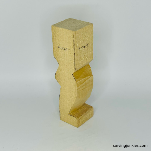 Right and front view of notches on little man caricature carving