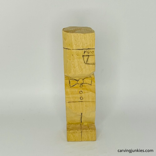 Front details drawn on little man caricature carving