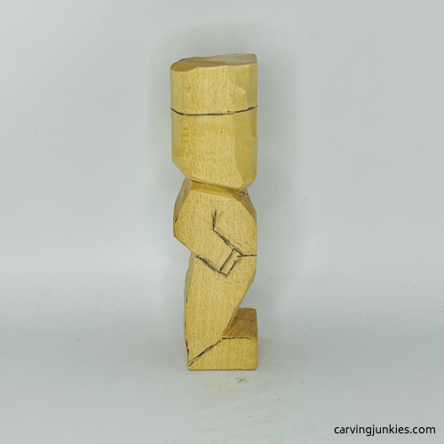 Right side of details on little man caricature carving