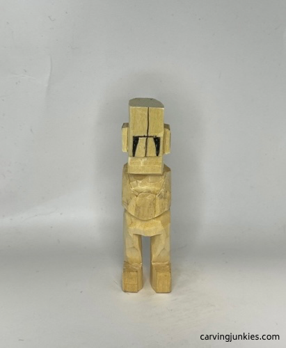 Ears cut on carved old man