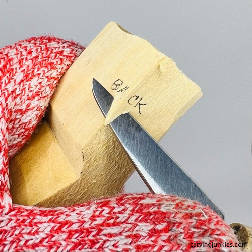 Rounding corners on little man caricature carving