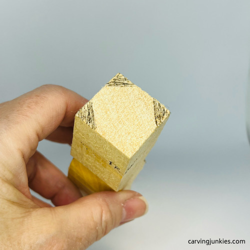 Areas of wood to remove on head of little man caricature carving