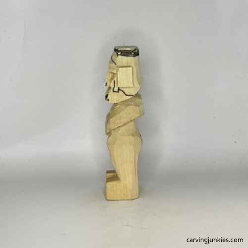 Head on carved old man is marked