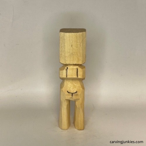 Back guidelines drawn on carved old man