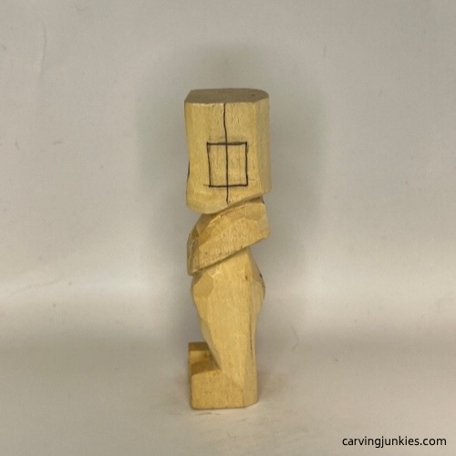 Left ear box on carved old man