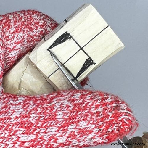 Making stop beneath the nose on carved old man