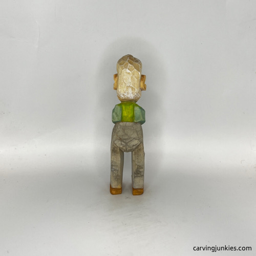 Back view of painted carved old man