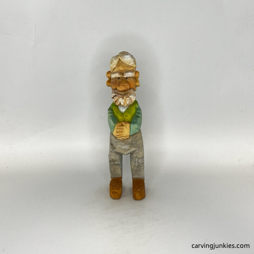 Front view of painted carved old man