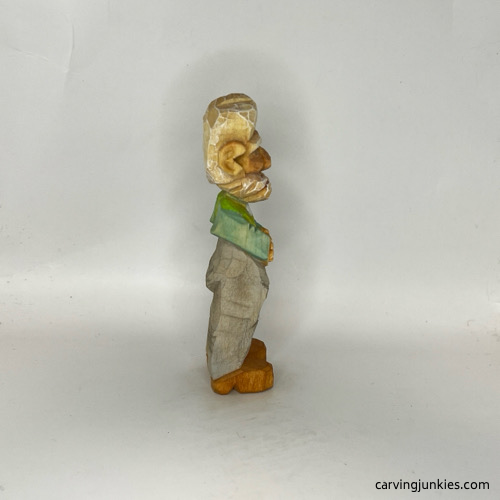 Right side of unpainted carved old man