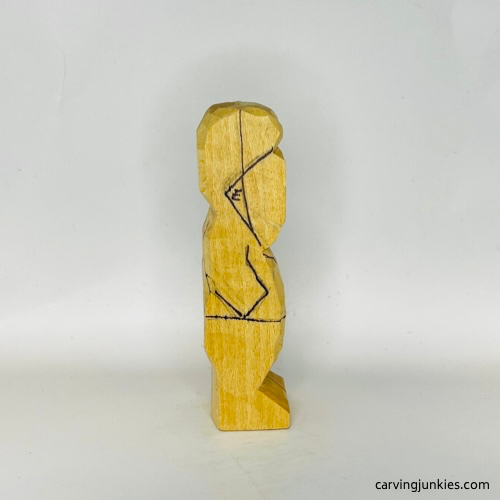 Right drawn details on tubby man wood carving Right details on tubby man wood carving