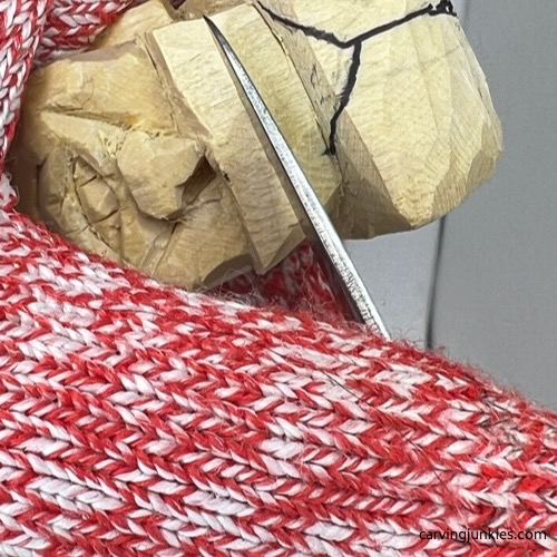 Shaping eyebrows on tubby man wood carving Carving eyebrows on tubby man wood carving