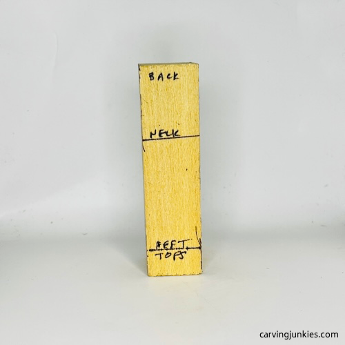 View of back guidelines for tubby man wood carving Back guidelines for tubby man wood carving