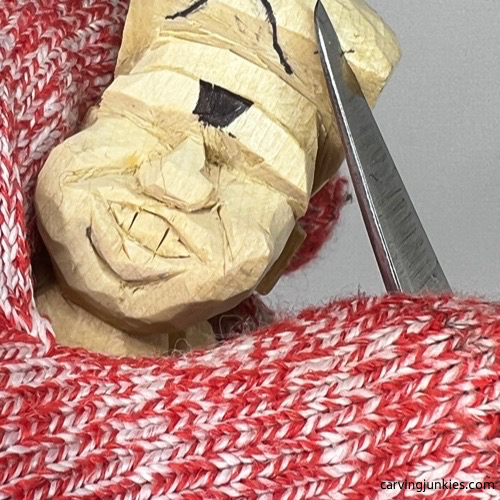 Carving hair on tubby man wood carving Shaping hair on tubby man wood carving