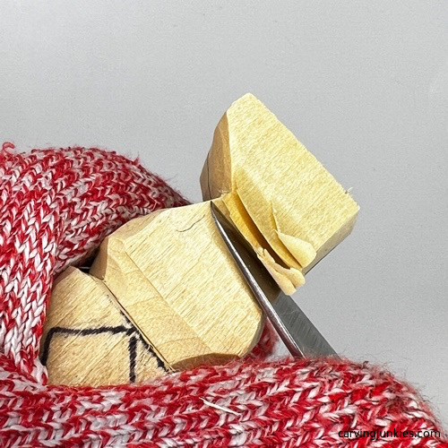 Shaping legs on tubby man wood carving Narrowing legs on tubby man wood carving