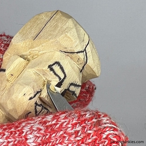 Shaping nose on tubby man wood carving Narrowing nose on tubby man wood carving