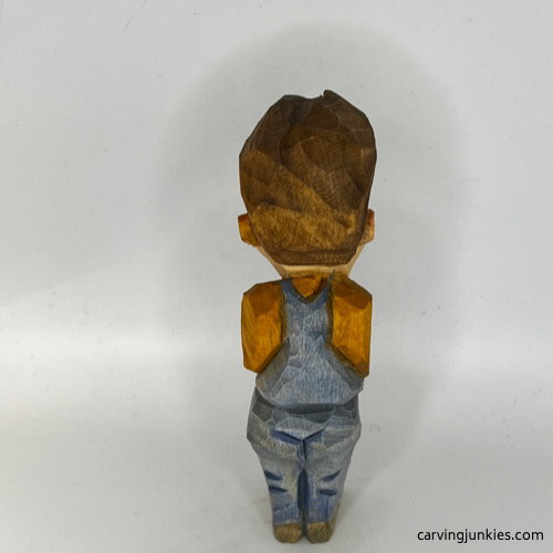 Back side of painted tubby man wood carving Back view of painted tubby man wood carving