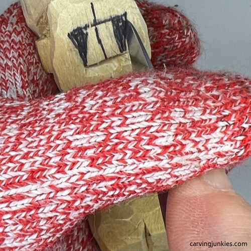 Cutting nose on side of tubby man wood carving Making pyramid cut for nose on tubby man wood carving