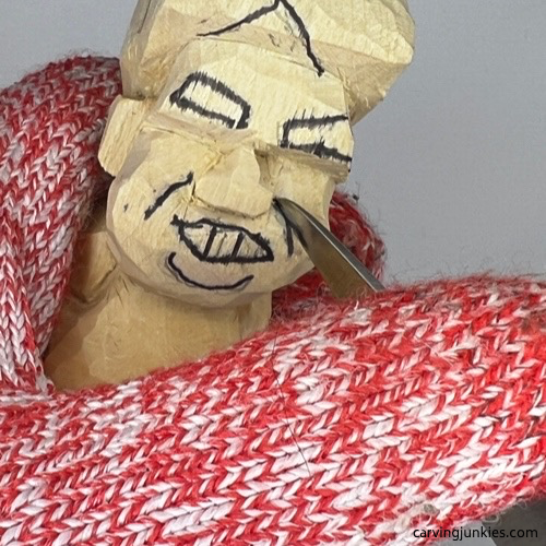 Cutting smile line for tubby man wood carving Carving smile line on tubby man wood carving