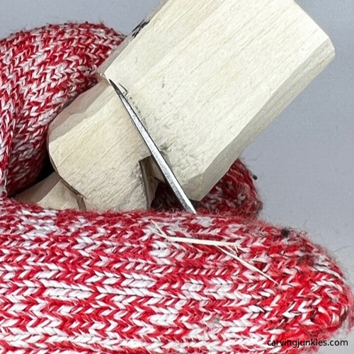 Separating the head on carved old man