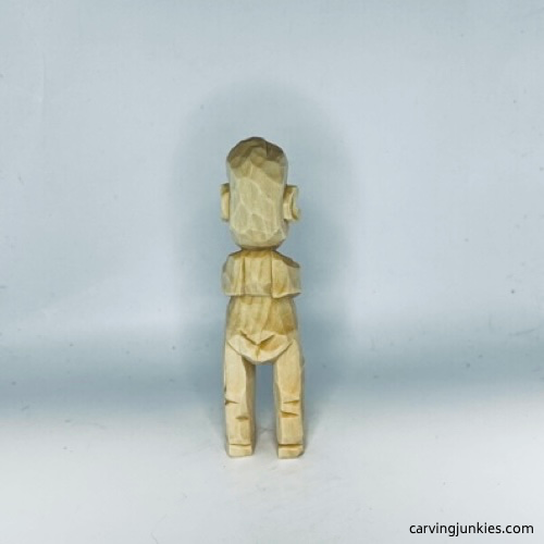 Back view of unpainted carved old man