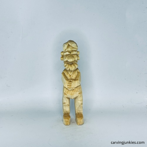 Front of unpainted carved old man