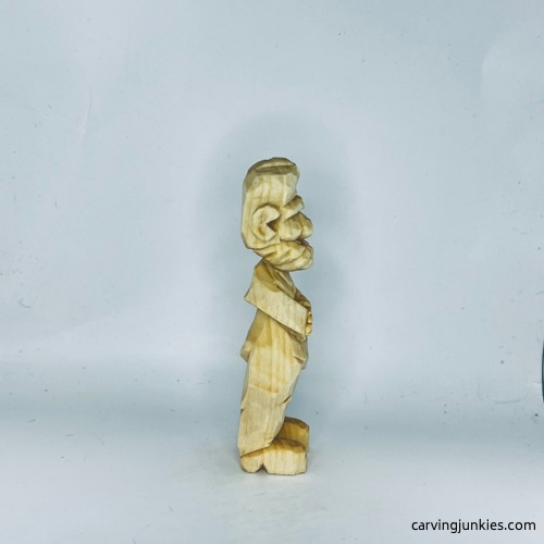 Right view of unpainted carved old man
