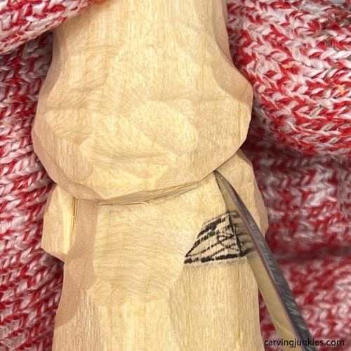 Carving the back arm of the wood carved mermaid