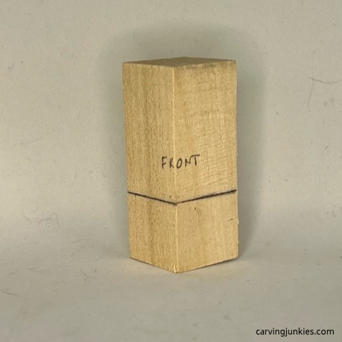 Guidelines on body of wood carved mermaid