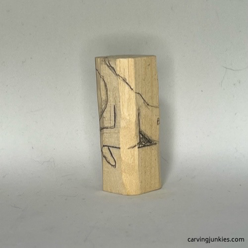 Left guidelines on body of wood carved mermaid 