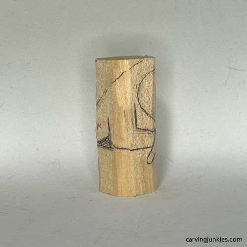 Right guidelines on body of wood carved mermaid