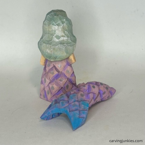 Back view of painted wood carved mermaid