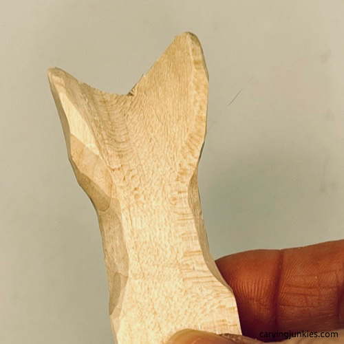 Progress shot of curved tail on wood carved mermaid